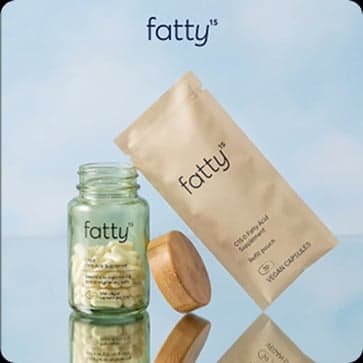 Fatty ad — supplement jar and pouch against a blue sky